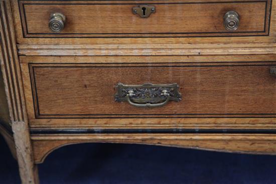 Lamb of Manchester. A Victorian Aesthetic movement ebony strung golden oak bookcase, W.3ft 11in. D.1ft 4in. H.4ft 6in.